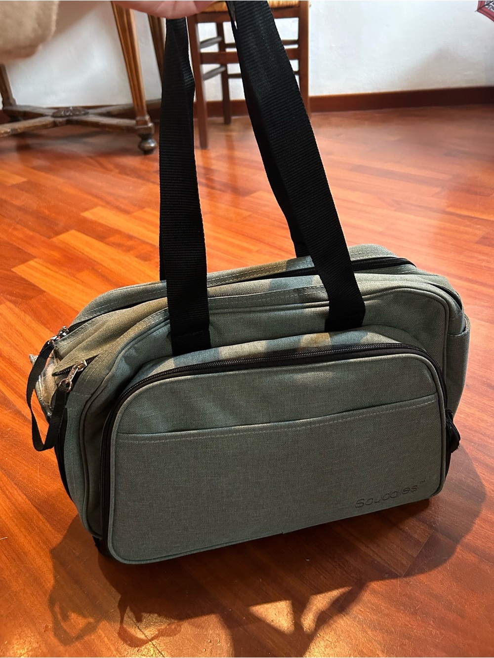 Compact convertible baby bed and diaper bag, perfect condition